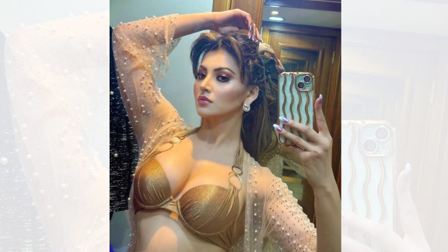 Sensational Beauty: Urvashi Rautela Flaunts Toned Physique in a Golden Bralette and Sheer Work Shrug 893187