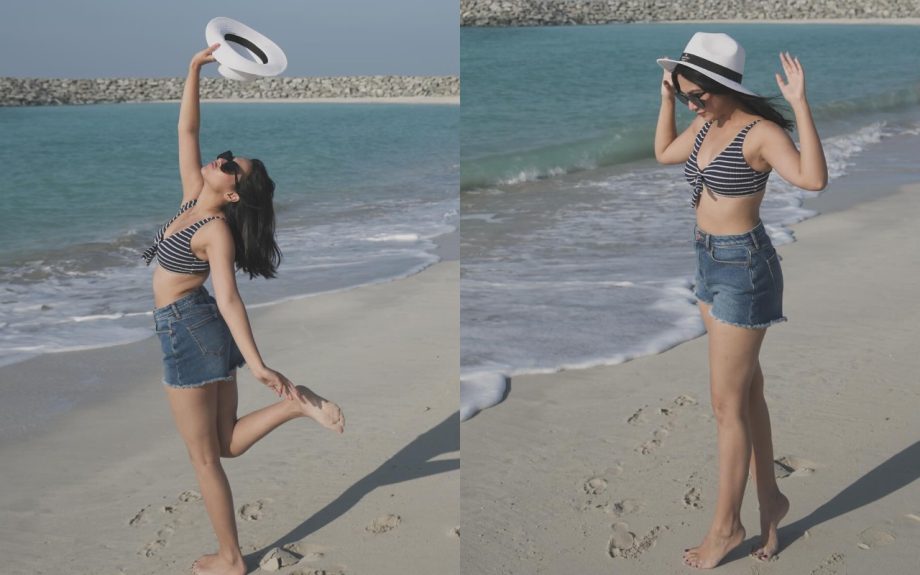 Reem Shaikh Slays Beach Fashion In Denim Short And Striped Bralette Top With A Chic Cowhat 930761