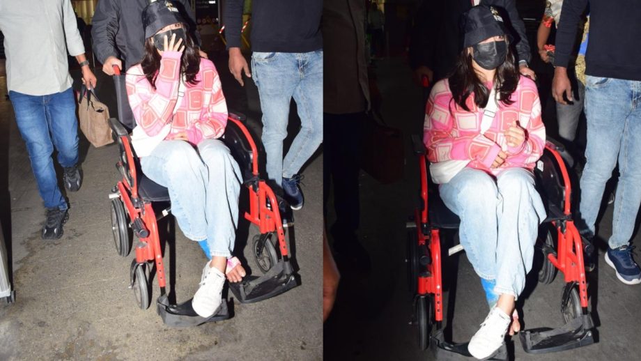 Despite the injury, the work must go on! Rashmika Mandanna spotted at Mumbai airport on a wheelchair! 933623