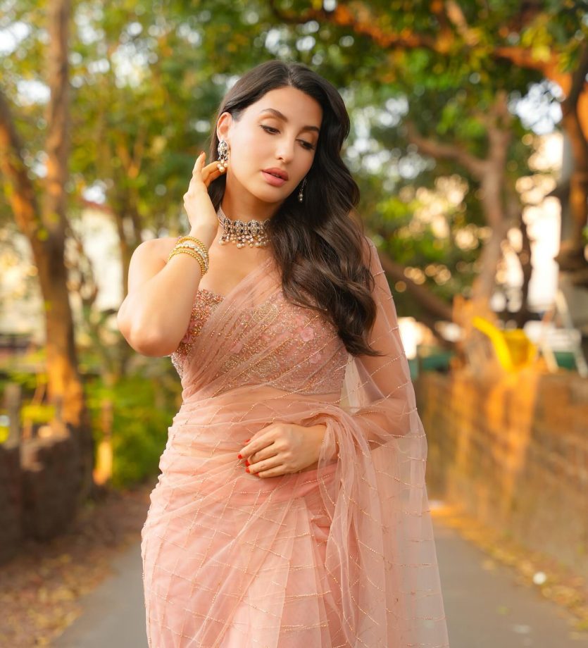 Nora Fatehi Shines in a Gorgeous Light Pink Saree, A Fashion Statement Like No Other 933170