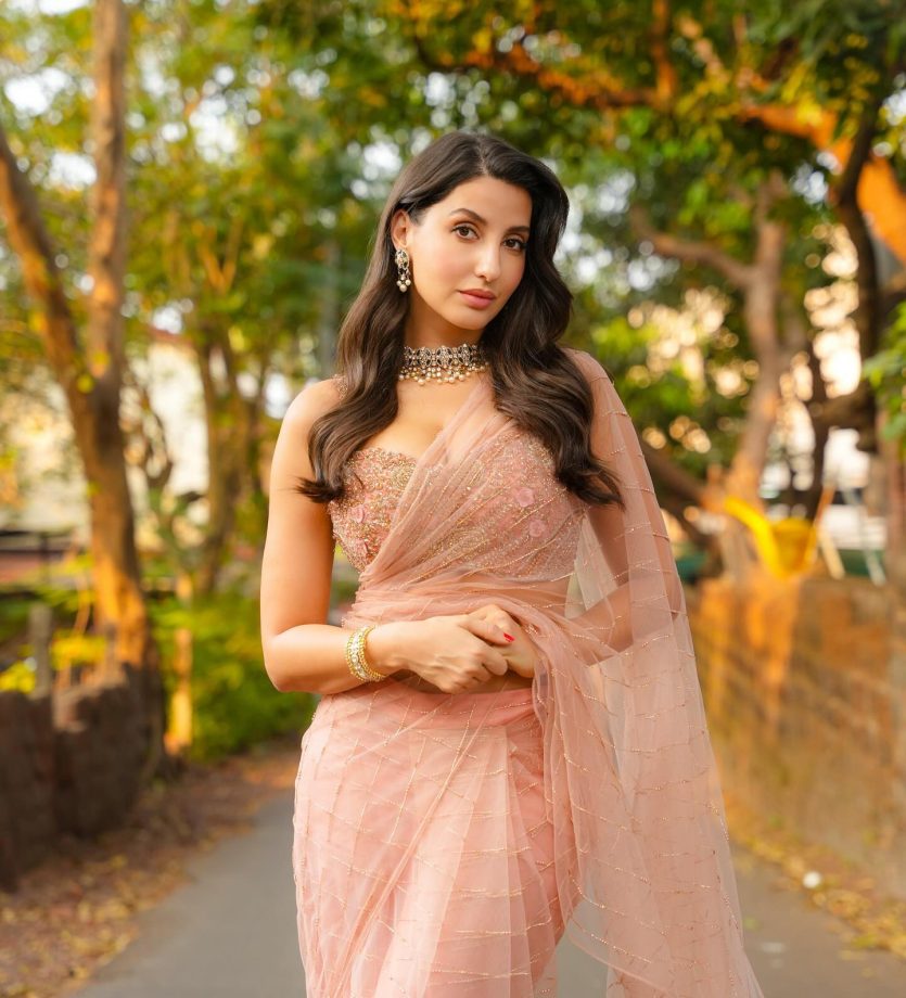 Nora Fatehi Shines in a Gorgeous Light Pink Saree, A Fashion Statement Like No Other 933171