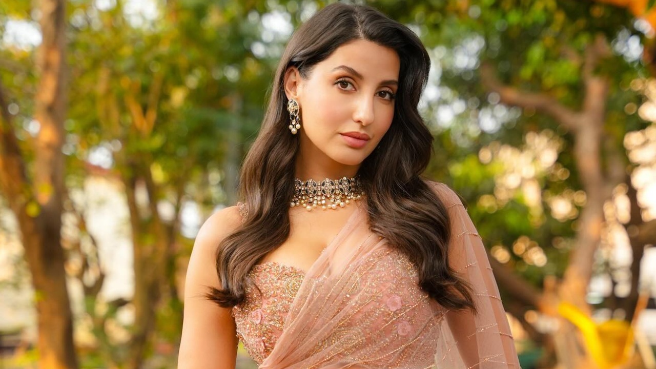 Nora Fatehi Shines in a Gorgeous Light Pink Saree, A Fashion Statement Like No Other 933173