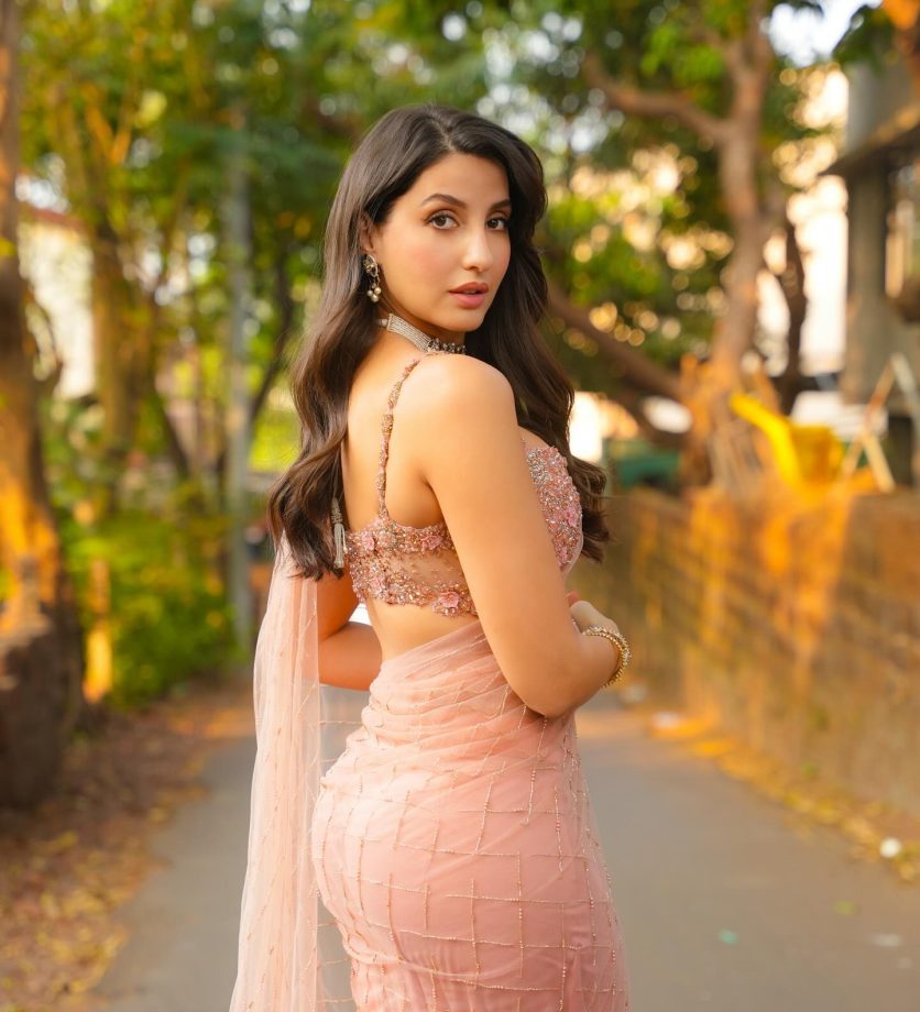 Nora Fatehi Shines in a Gorgeous Light Pink Saree, A Fashion Statement Like No Other 933169