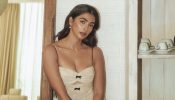 Pooja Hegde Stuns in a Chic Cream Bodycon Dress with Elegant Details 935110