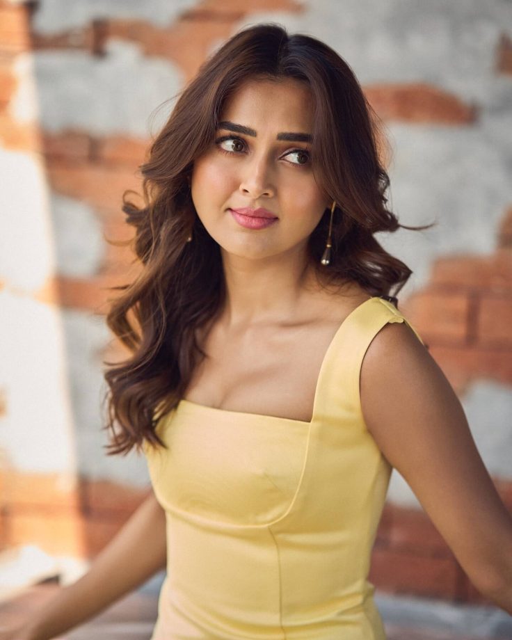 Tejasswi Prakash Stuns in a Fitted Yellow Dress with Flare 935138