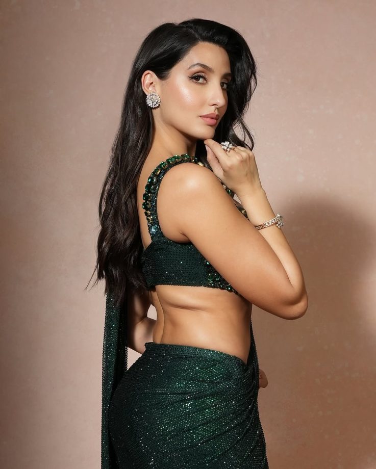 Nora Fatehi Dazzles in a Shimmering Green Saree with an Emerald Embellished Blouse 936144