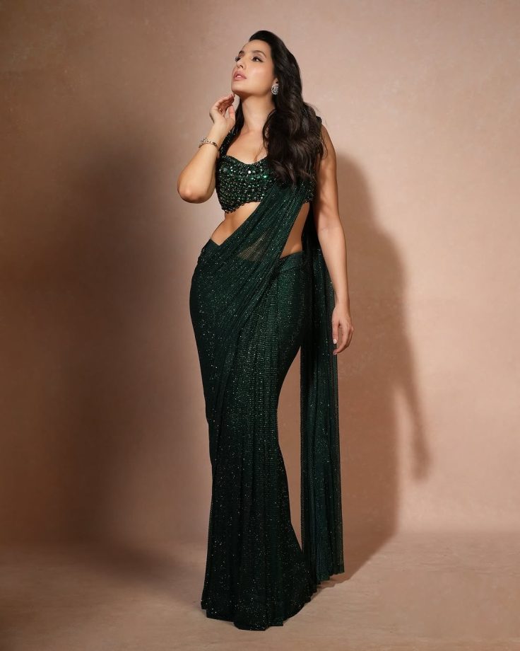 Nora Fatehi Dazzles in a Shimmering Green Saree with an Emerald Embellished Blouse 936145