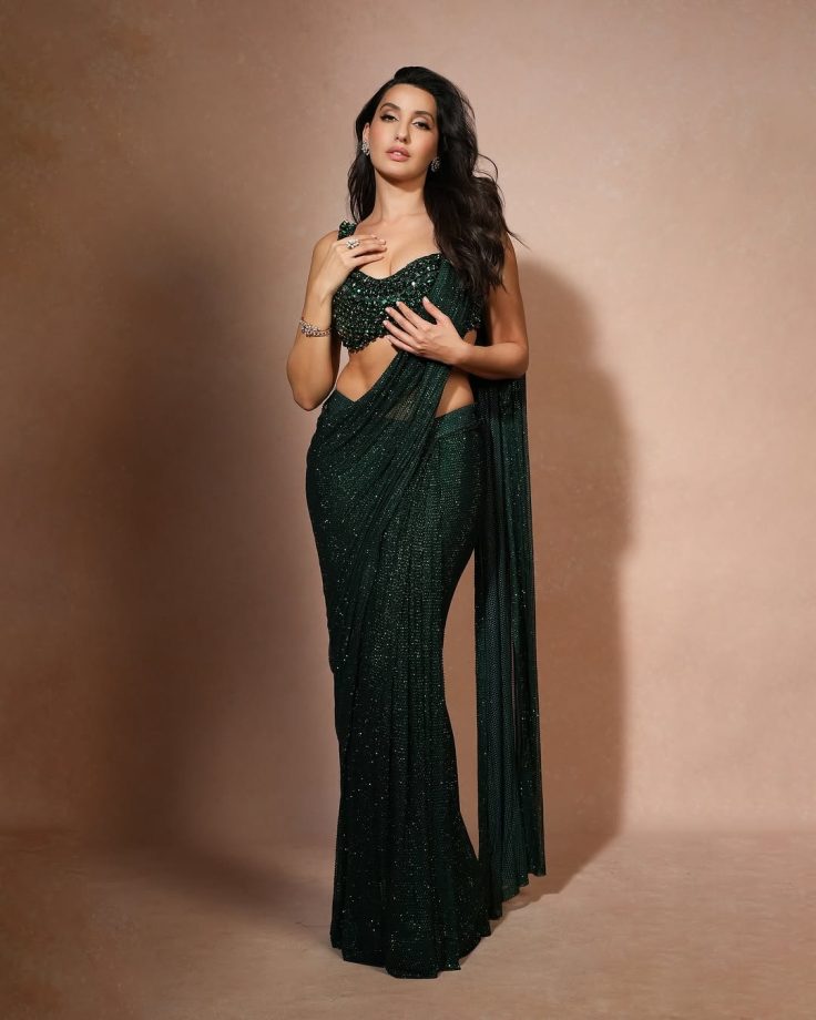 Nora Fatehi Dazzles in a Shimmering Green Saree with an Emerald Embellished Blouse 936146