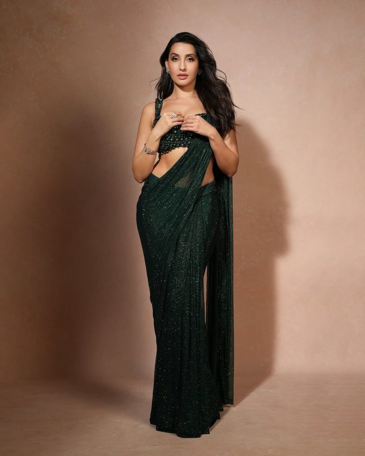 Nora Fatehi Dazzles in a Shimmering Green Saree with an Emerald Embellished Blouse 936142