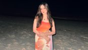 Palak Sindhwani Channels Mermaid Vibes in a Bold Orange Swimsuit by the Ocean 936175