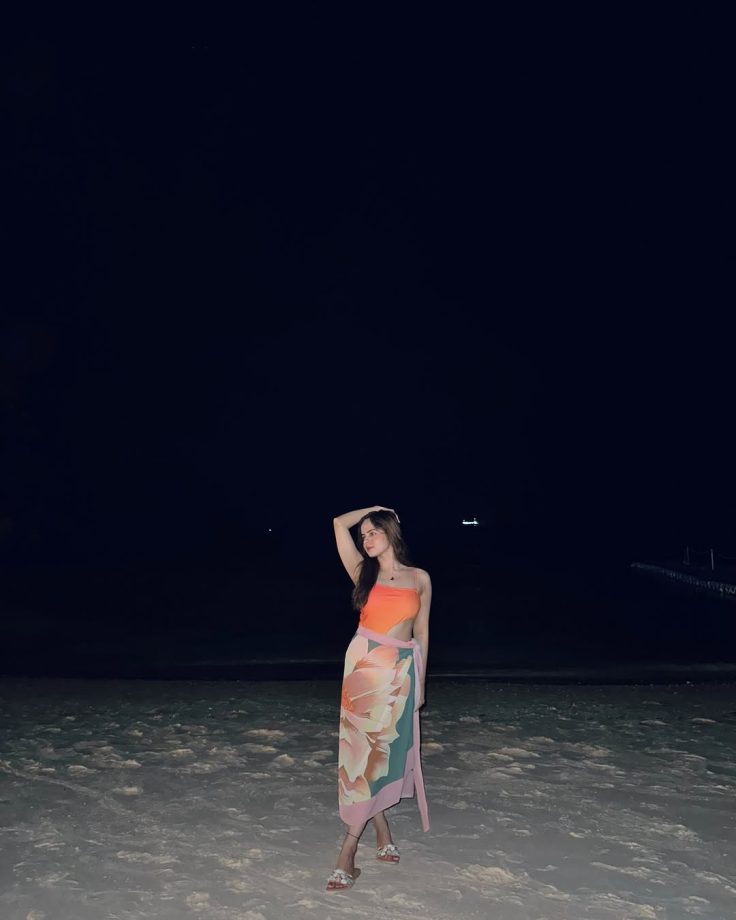 Palak Sindhwani Channels Mermaid Vibes in a Bold Orange Swimsuit by the Ocean 936179