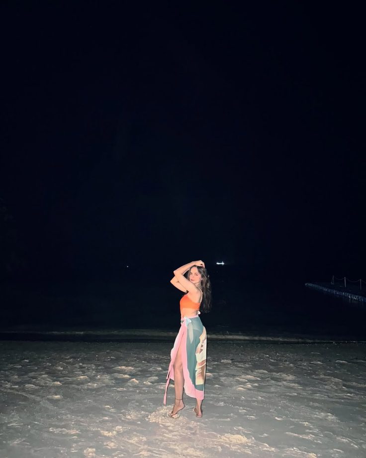 Palak Sindhwani Channels Mermaid Vibes in a Bold Orange Swimsuit by the Ocean 936180