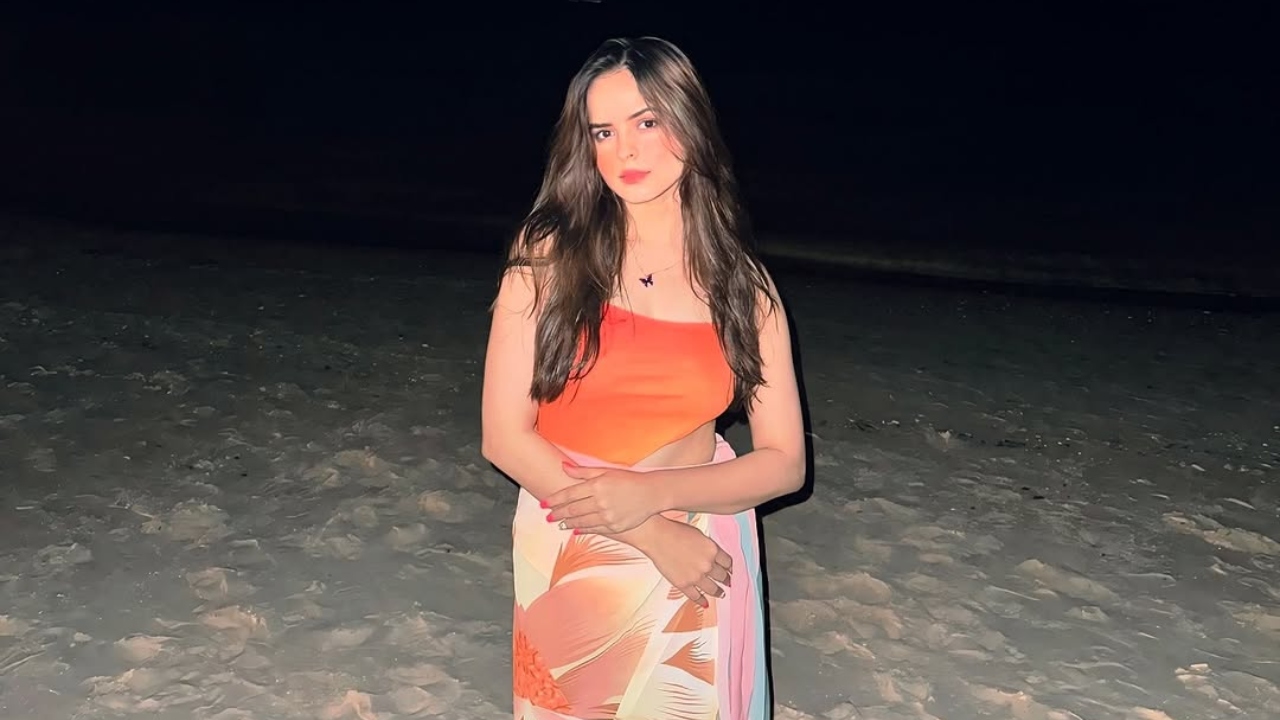 Palak Sindhwani Channels Mermaid Vibes in a Bold Orange Swimsuit by the Ocean 936175