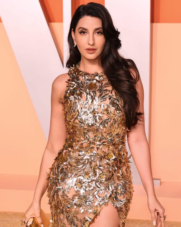 Nora Fatehi shines & glitters in a gold ensemble at the 2025 Vanity Fair Oscars Afterparty 939256