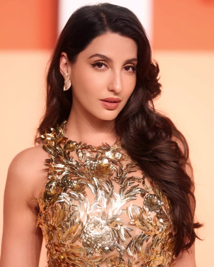 Nora Fatehi shines & glitters in a gold ensemble at the 2025 Vanity Fair Oscars Afterparty 939257